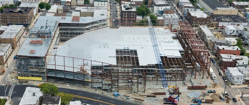 Aerial view of active construction site with steel decking