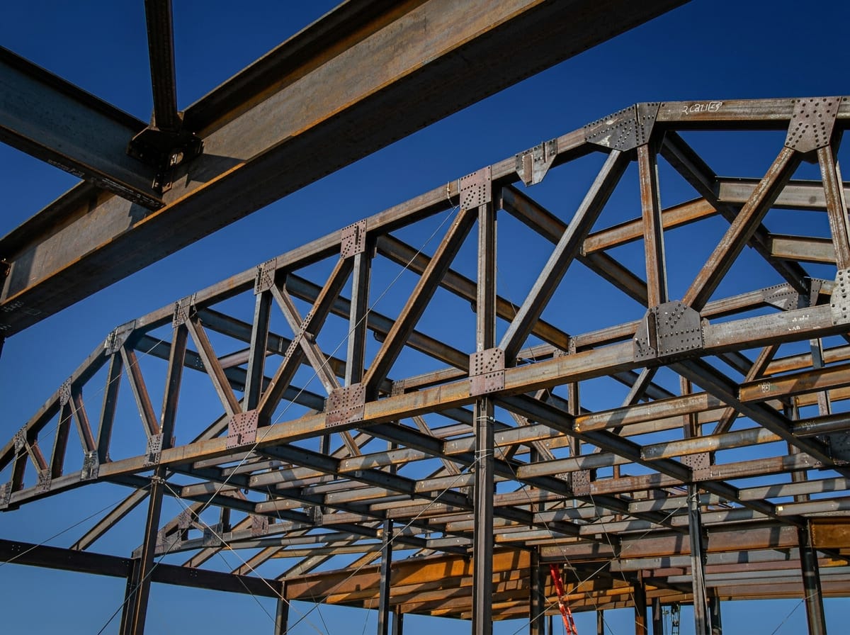 Steel trusses against clear blue sky